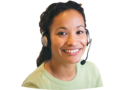 Female employee with headset looking up and smiling