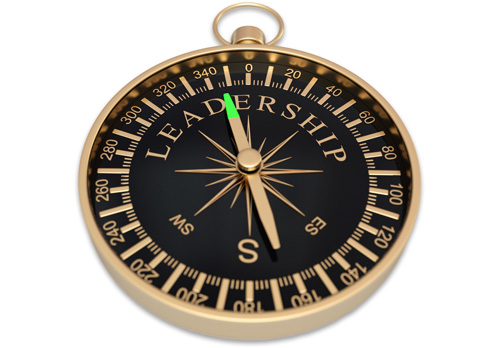 Gold and black compass with the word Leadership on its face
