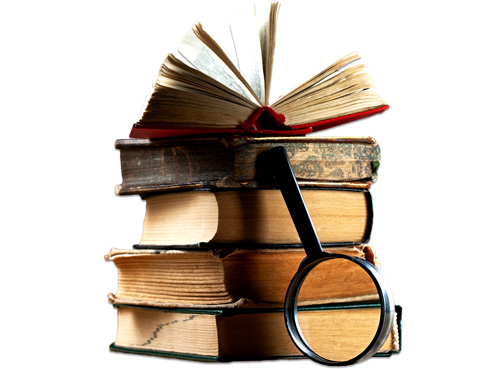 Stack of old history books with a magnifying glass