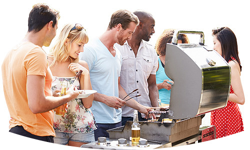 Young couples outdoors, chatting and eating around a barbecue